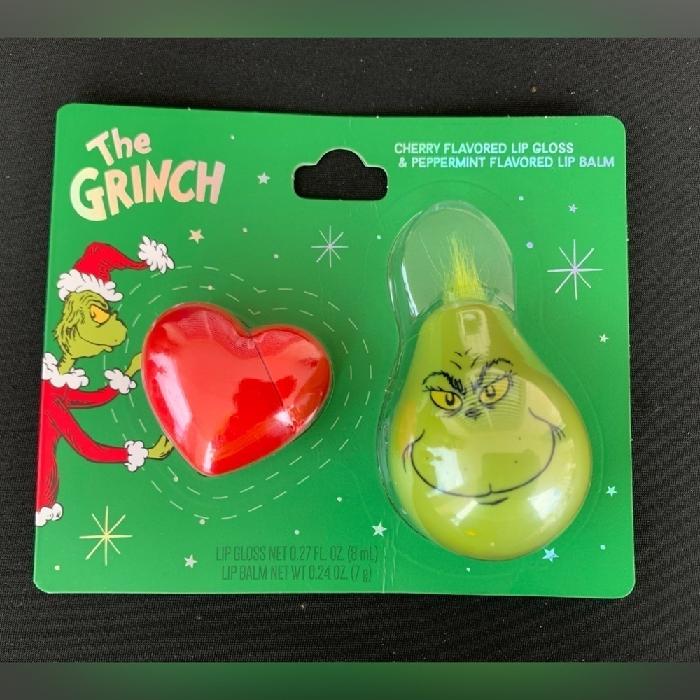 The GRINCH CHERRY FLAVORED LIP GLOSS
& PEPPERMINT FLAVORED LIP BALM